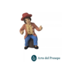 Uomo seduto su tronco in Terracotta da 7cm 219/26